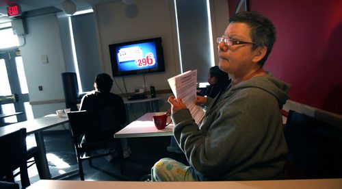 Mary Hurst grabs a morning coffee in the Bell's common room where "The Price is Right" is a favorite morning passtime on TV. She's a resident at the Bell Hotel where the Main Street Project works a "Harm Reduction" program.  See Randy Turner's Homeless feature. February 20, 2014 - (Phil Hossack / Winnipeg Free Press)