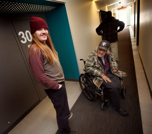 "Jonah" a resident at the Bell Hotel where the Main Street Project works a "Harm Reduction" program, visits with a pair of other residents at the "Bell". See Randy Turner's Homeless feature. February 20, 2014 - (Phil Hossack / Winnipeg Free Press)