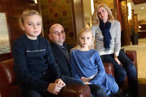 Karl and Petra Dornetschuber and their kids, Ben, 10 and Anna 7, in the lobby of the Fairmont Hotel, Friday, February 28, 2014. The families' Wellington Crescent home burned on February 16th. (TREVOR HAGAN/WINNIPEG FREE PRESS)