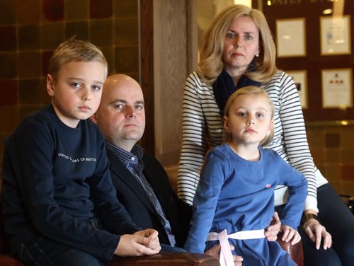 Karl and Petra Dornetschuber and their kids, Ben, 10 and Anna 7, in the lobby of the Fairmont Hotel, Friday, February 28, 2014. The families' Wellington Crescent home burned on February 16th. (TREVOR HAGAN/WINNIPEG FREE PRESS)