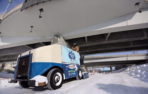 An ice cleaner drives under the Main Street Bridge along the River Trail near The Forks, Friday, February 28, 2014. (TREVOR HAGAN/WINNIPEG FREE PRESS)