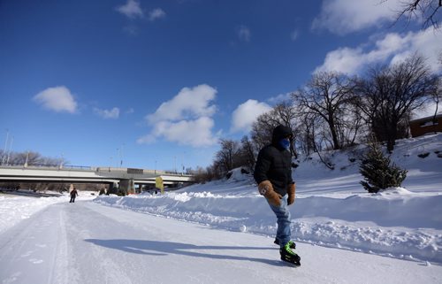 A man skates along the River Trail near The Forks, Friday, February 28, 2014. (TREVOR HAGAN/WINNIPEG FREE PRESS)