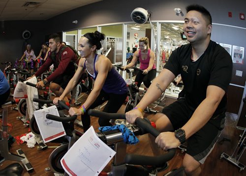 March 1, 2014 - 140301  - (R to L) Oliver Hernandez, Lisa Brignell and Haeedar Azooz take part in the GoodLife Kids Foundation's Spin4Kids one day spin-a-thon at GoodLife Fitness Saturday, March 1, 2014. John Woods / Winnipeg Free Press
