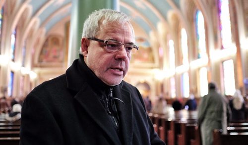 Dr. Terry Babick a 3rd generation Ukrainian Canadian with family in Ukraine talks about the situation in Ukraine after service at Sts. Vladimir & Olga Cathedral (Ukrainian Catholic Church) on McGregor Street Sunday morning.  140302 March 2, 2014 Mike Deal / Winnipeg Free Press