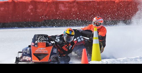 Racers make their way around the half-mile ice oval in Beausejour, MB during the 52nd annual Canadian Power Toboggan Championships Sunday afternoon.   140302 March 2, 2014 Mike Deal / Winnipeg Free Press