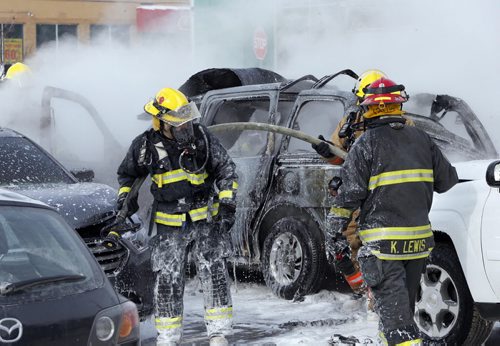 Car explosion  and fire in parking lot of Super Store on Sargent Ave at St. James St , there was one large explosion that rocked the store  then one or two smaller ones , the van that exploded was carrying propane  , 3 other cars were damaged ,   , roof ripped off van . Mar. 3 2014 / KEN GIGLIOTTI / WINNIPEG FREE PRESS