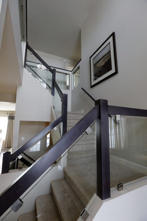 carpete & glass stairway to second floor, Homes . Parade of Homes .39 Stan Bailie Dr. - todd lewys story Mar. 3 2014 / KEN GIGLIOTTI / WINNIPEG FREE PRESS