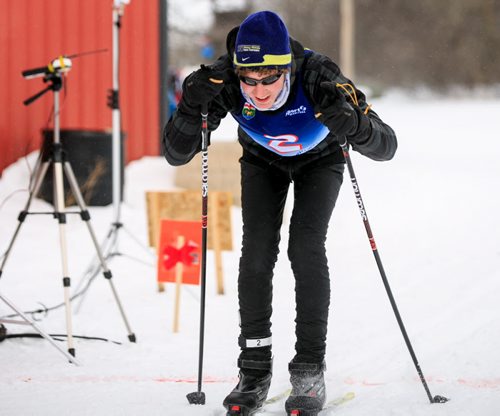 Jesse Bachinsky, 15, smiles as he crosses the finish line of the 7.5km male juvenile cross country ski race, as part of the 2014 Power Smart Manitoba Winter Games at Birch Ski Area in Roseisle, MB. Bachinsky is thought to be the first ever visually impaired athlete to compete in cross country skiing at the Manitoba Games. 140303 - Monday, {month name} 03, 2014 - (Melissa Tait / Winnipeg Free Press)