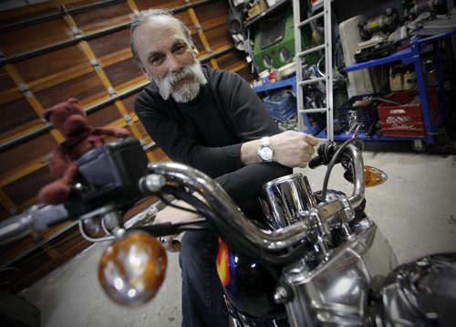 March 3, 2014 - 140303  -  Robyn (a.k.a. Robert) Gray is photographed on a motorcycle in his garage, Monday, March 3, 2014. Gray was cleared Monday of obstruction and assault charges on a police officer at the Winnipeg Convention Centre motorcycle show in 2012. He was the organizer of the Rolling Thunder portion of the World of Wheels show. John Woods / Winnipeg Free Press