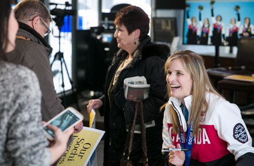 Jennifer Jones, 2014 Olympic curling gold medal winner, laughs with fans as she signs autographs at the Winnipeg Free Press News Caf¾© Tuesday afternoon. The Jones rink will drop the puck at the Winnipeg Jets game Tuesday night at MTS Centre.   140304 - Tuesday, {month name} 04, 2014 - (Melissa Tait / Winnipeg Free Press)
