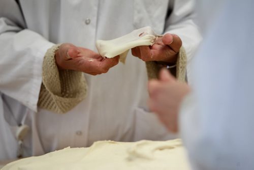 Canadian International Grains Institute baking staff examine dough properties after mixing with western Canadian wheat in CigiÄôs pilot bakery.  On Tuesday Viterra Inc. and Cigi announced that Viterra is investing $1 million to support Cigi in its ongoing efforts to promote Canadian field crops to customers in domestic and international markets.  March 04, 2014 Ruth Bonneville / Winnipeg Free Press
