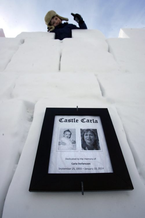 Home Street resident David Neyedli built a giant ice castle/slide in the front yard of his home that for the neighbourhood children. He dedicated this year's "bigger and better" version to his neighbour Carla Stefansson who died of cancer on Jan. 10, 2014 and watched him build it from her window above as she fought the disease. On top is Luke who lives nearby. Ashley Prest story   Wayne Glowacki / Winnipeg Free Press March 4   2014