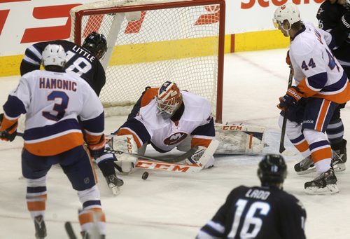 Bryan Little #18 with the Winnipeg Jests tries to get the puck past New York Islanders goalie during the second period of play  at the MTS Centre Tuesday.  March 04, 2014 Ruth Bonneville / Winnipeg Free Press