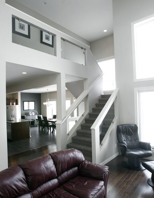Homes. The main floor staircase in the house at 27 Red Moon Road in Sage Creek, the realtor is  Ryan Davis.  Todd Lewys story   Wayne Glowacki / Winnipeg Free Press March 5   2014