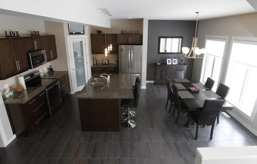 Homes. The kitchen and dining area in the house at 27 Red Moon Road in Sage Creek, the realtor is  Ryan Davis.  Todd Lewys story   Wayne Glowacki / Winnipeg Free Press March 5   2014