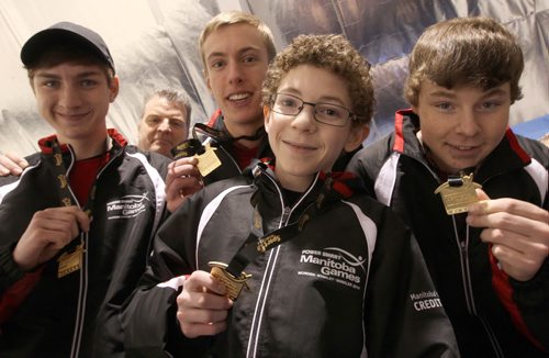 Under 18 team central celebrates gold metal curling win L to R front   Second Noah Miller, Third Jeremy Warne, lead Colton Gibb, and skip Brandon Radford with coach Mark Radford, rear, at the 2014 Morden Stanley Winkler Power Smart Manitoba Games Wednesday