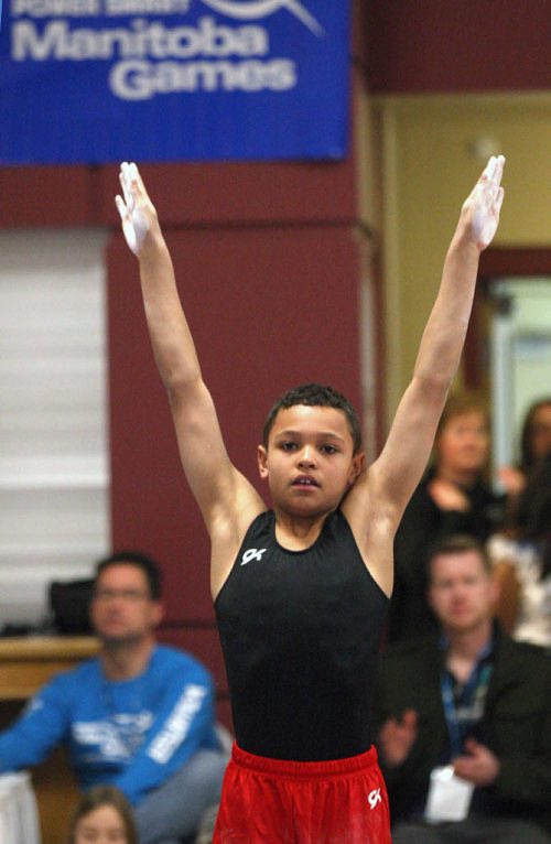 Aaron Thomas from Winnipeg Gold competes in the high bar at the The 2014 Morden Stanley Winkler Power Smart Manitoba Games Wednesday being held in Winkler/Morden- The games wrap up Mar 08-   Standup photo- Mar 05, 2014   (JOE BRYKSA / WINNIPEG FREE PRESS)