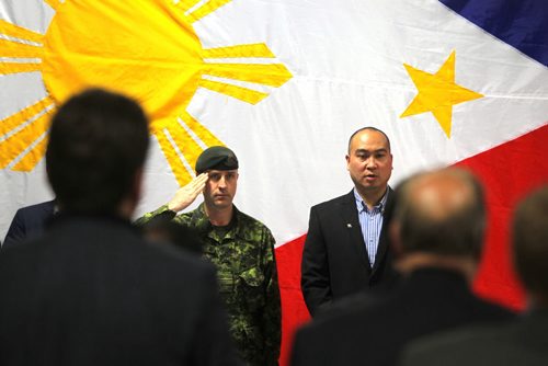 Canadian Forces Appreciation night for DART at the Filipino Canadian Seniors Hall on Euclid. Major Robert Meade came in from Ontario and was part of the Dart Team that helped in the last disaster in the Philippines. In photo Meade and Jon Reyes. BORIS MINKEVICH/WINNIPEG FREE PRESS  MARCH 5, 2014