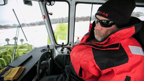 Brian Sparks operates an Amphibex icebreaker from the cabin. Three Amphibex icebreakers are in use this season, through the end of March, to break up 30 km of ice on the Red River between Netley Lake and Selkirk. The breaking of the ice reduced the chances of ice jams along the river, which reduces the chances of flooding. Doug Speirs column 140305 - Wednesday, {month name} 05, 2014 - (Melissa Tait / Winnipeg Free Press)