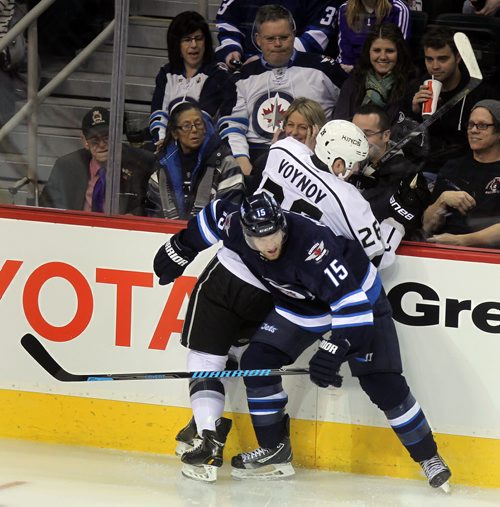 Winnipeg Jets Captain Andrew addcorners Los Angeles King SlavaVoynov in first period action at the MTS Center Thursday. See story. March 6, 2014 - (Phil Hossack / Winnipeg Free Press)
