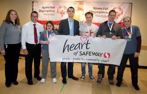 Special Olympics - Canada Safeway Madison Avenue Store  Safeway kicked off their annual Special Olympics fundraising efforts with a bocce bowling event at their Madison Avenue Location. Local celebrities teamed up with Special Olympians for the in-store competition. Donations can be made at all Safeway locations. Visit specialolympics.mb.ca to learn more about Special Olympics in Manitoba.  (L-R)) Phyllis Fehr (Madison Square Safeway Assistant Manager) and Rick Champagne (Store Manager), Darcie Godard (Special Olympics Manitoba athlete), Mitch Rosset (Global Winnipeg), Matt Sutton (Fresh 99.1 FM Radio), Derek Taylor (Global Winnipeg), Doug Slobodian (Special Olympics Manitoba athlete)