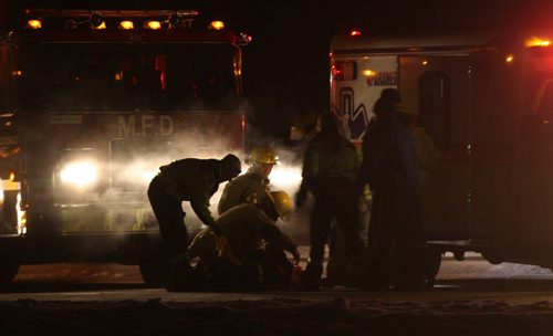 Emergency crews work on Hwy 101 approximately one km north of McGillivray Blvd to rescue those injured in a car that smashed into the rear of a flatbed semi trailer Friday night near 10 PM-   Breaking News- Mar 06, 2014   (JOE BRYKSA / WINNIPEG FREE PRESS)