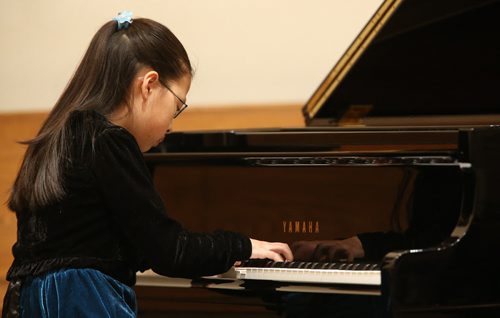 Catherine Dong, 11, performs in the Grade 7 Canadian Composers section of the Winnipeg Music Festival at the Sterling Mennonite Fellowship, Saturday, March 8, 2014. (TREVOR HAGAN/WINNIPEG FREE PRESS)