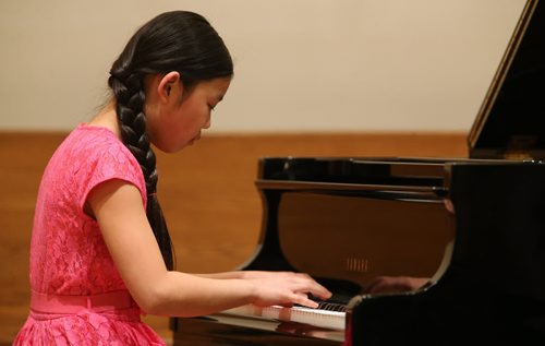 Amy Kong, 10, performs in the Grade 7 Canadian Composers section of the Winnipeg Music Festival at the Sterling Mennonite Fellowship, Saturday, March 8, 2014. (TREVOR HAGAN/WINNIPEG FREE PRESS)