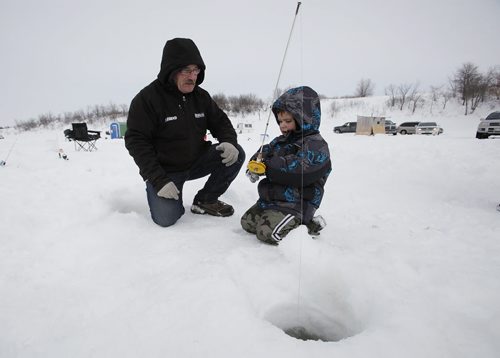 March 9, 2014 - 140309  - Andy Tousiquant helps his four year old grandson Colten ice fish on the Red River just north of Lockport Sunday, March 9, 2014. Ice fishers must remove their huts by the end of today. John Woods / Winnipeg Free Press