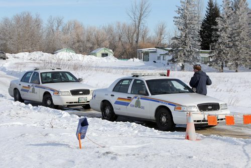 RCMP continue to investigate a death on a property on McGillivray Boulevard, between Kenaston Boulevard and McCreary Road. BORIS MINKEVICH / WINNIPEG FREE PRESS  March 10, 2014