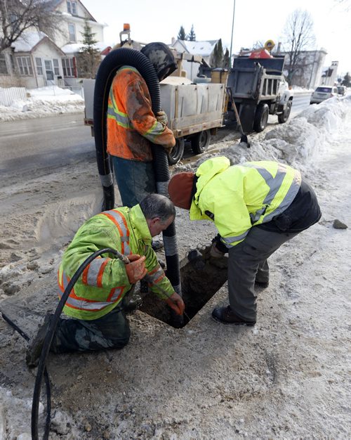 City Infrastructure story Äìin pic city and contract workers prepare ground  for heating  frozen water pipes  on Mountain Ave  at Salter for homes without water   - Mar. 10 2014 / KEN GIGLIOTTI / WINNIPEG FREE PRESS