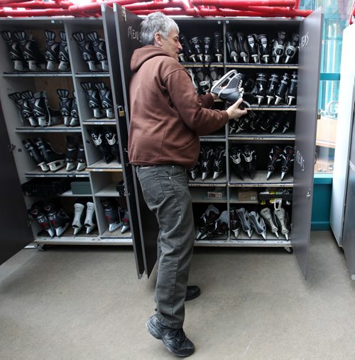 Mike Masyoluk packs away skates at the Forks Tuesday after the main river trail was closed for the season-    Standup photo- Feb 11, 2014   (JOE BRYKSA / WINNIPEG FREE PRESS)