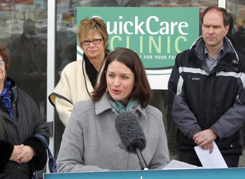 QUICKCARE CLINICS - Initiatives to help ensure all Manitobans have access to a family doctor by 2015 and location of a new QuickCare Clinic. In front of future clinic. Health Minister Erin Selby addresses the media. In behind is Nancy Allan, MLA, and Dr. Mark Duerksen,. BORIS MINKEVICH / WINNIPEG FREE PRESS  March 11, 2014