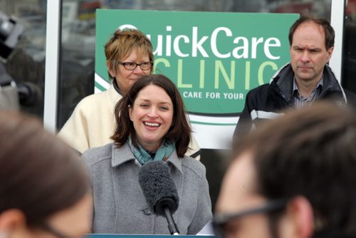 QUICKCARE CLINICS - Initiatives to help ensure all Manitobans have access to a family doctor by 2015 and location of a new QuickCare Clinic. In front of future clinic. Health Minister Erin Selby addresses the media. In behind is Nancy Allan, MLA, and Dr. Mark Duerksen,. BORIS MINKEVICH / WINNIPEG FREE PRESS  March 11, 2014