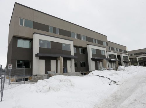 On Troy Avenue, between McPhillips Street and Fife Street - Courts Äì 19 multi family residential buildings being  built instead of a promised park  , by developer  Andrew Marquess , Story by Aldo Santin . Mar. 11 2014 / KEN GIGLIOTTI / WINNIPEG FREE PRESS