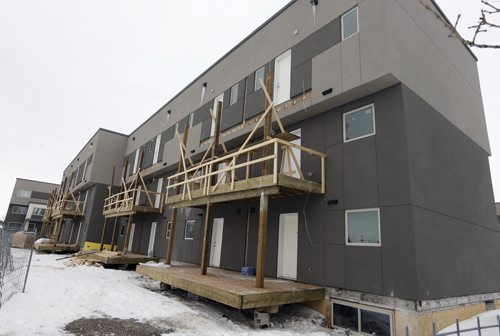 On Troy Avenue, between McPhillips Street and Fife Street - Courts Äì 19 multi family residential buildings being  built instead of a promised park  , by developer  Andrew Marquess , Story by Aldo Santin . Mar. 11 2014 / KEN GIGLIOTTI / WINNIPEG FREE PRESS