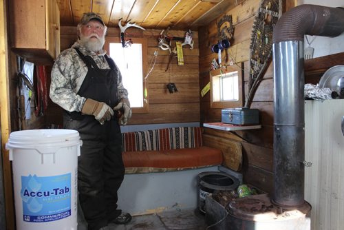 Cyrill Lillies inside his fishing shack. Story is how fish have found theIr way into  the Shoal Lakes in the Interlake for the first time in living memory, thanks to flooding.  It's the consolation prize for farmers who have been flooded out. March 10 2014. Bill Redekop story / photo / Winnipeg Free Press.