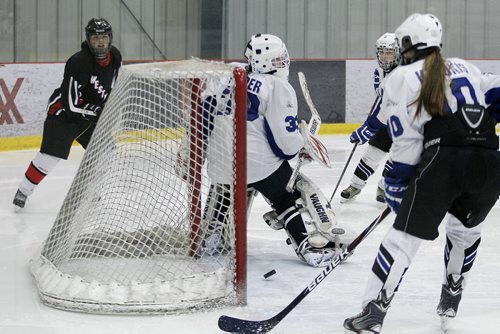 March 11, 2014 - 140311 -  Westwood Warriors' Avery Baker (2) scores on Selkirk Royals' Shaelyn Pepper (33) in game 2 of the WWHSHL Division B final at MTS IcePlex Tuesday, March 11, 2014. Westwood Warriors tied the series 1-1.John Woods / Winnipeg Free Press