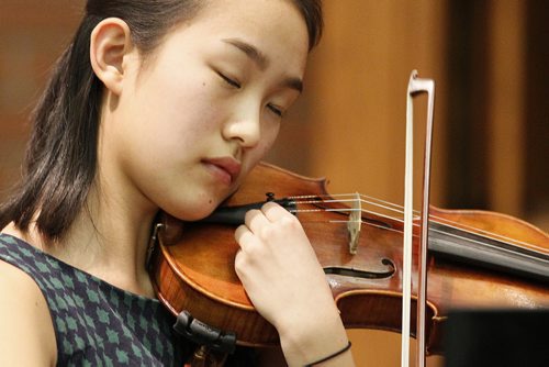 March 11, 2014 - 140311  -  Grace Ma fine tunes her violin prior to performing Concerto in G minor, op.26, 3rd mvt. by Max Burch in the Winnipeg Music Festival at Young United Church Tuesday, March 11, 2014. John Woods / Winnipeg Free Press