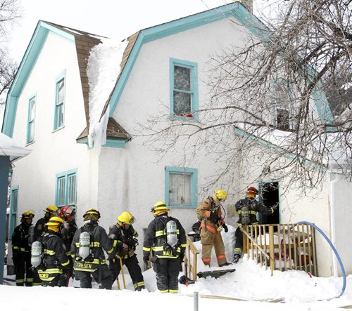 Winnipeg Fire Fighters at a house fire in the 300 block on Boyd Ave. near Aikins St. Wednesday afternoon. One male was checked out at the scene by paramedics. Wayne Glowacki / Winnipeg Free Press March 12   2014