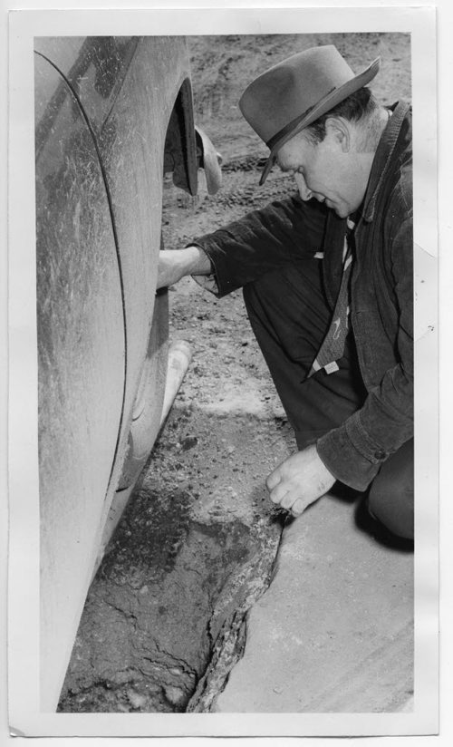 Winnipeg Free Press Archives April 21, 1960 Fred Litke looks into the hole his car drove over on Carlton Street.