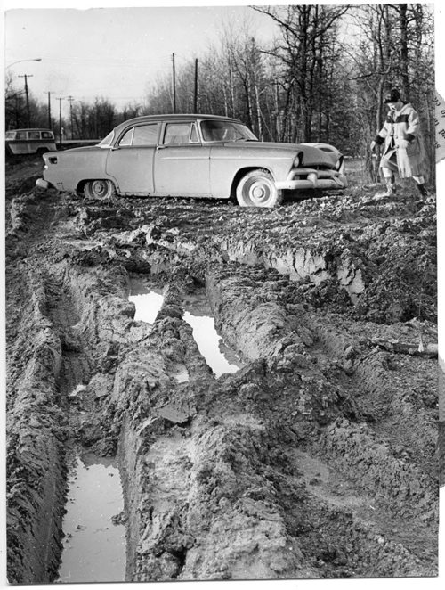 Winnipeg Free Press Archives April 12, 1965 Mrs. John Hjaltason's car is glued in the gumbo near her home on Marlton Crescent in Charleswood, and she says it will stay there until the municipality cleans up the road.