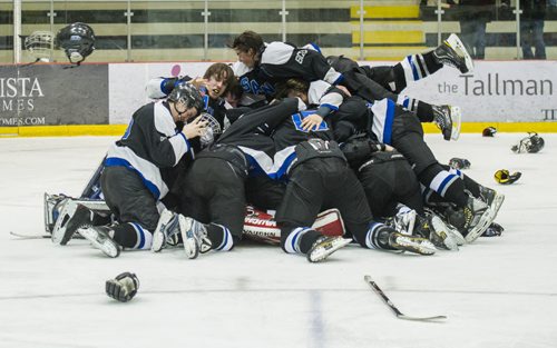 140312 Winnipeg - DAVID LIPNOWSKI / WINNIPEG FREE PRESS - March 12, 2014  The Sanford Sabres celebrate their win over the Lord Selkirk Royals after their Winnipeg High School hockey league championship game at the MTS Iceplex Wednesday afternoon.