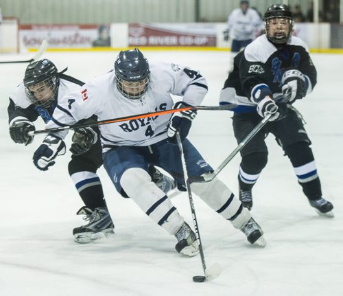 140312 Winnipeg - DAVID LIPNOWSKI / WINNIPEG FREE PRESS - March 12, 2014  Lord Selkirk Royals Kale Ilchena (#4) looks to break through the Sanford Sabres during their Winnipeg High School hockey league championship game at the MTS Iceplex Wednesday afternoon. The Sabres won the game.