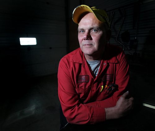 Phil Admiral poses in his Stonewall auto repair shop Thursday, see Bill Redekopp story re: the Plymouth Brethren, a cult-like Christian Sect  March 13, 2014 - (Phil Hossack / Winnipeg Free Press)