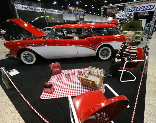 Stdup World of Wheels , let the picnic begin Faye Lee from Luverne North Dakota sits at her picnic spot with her 1957 Buick Caballero station wagon ready for the weekend World of Wheels Car Show where her car is on display  at the Wpg Convention Centre . Mar. 14 2014 / KEN GIGLIOTTI / WINNIPEG FREE PRESS