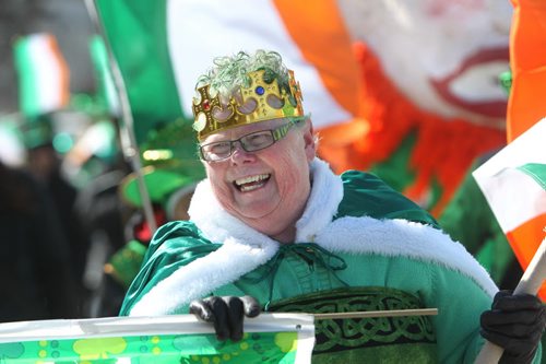 Catriona Younger is all smiles as she and her husband Bill head up the St Patrick Day Parade as they make their way around down town near Shannon's Irish Pub Saturday afternoon in celebration of St. Patrick's Day.  March 15, 2014  Ruth Bonneville / Winnipeg Free Press