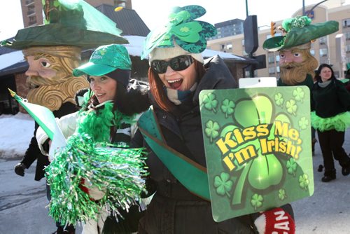 Katie Fowler is all smiles as she marches in the St Patrick Day Parade with friends on York Ave. near Shannon's Irish Pub Saturday afternoon in celebration of St. Patrick's Day.  March 15, 2014  Ruth Bonneville / Winnipeg Free Press
