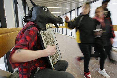 March 16, 2014 - 140316  -  Blaine the horse headed busker plays his music in a walkway prior to a Jet game Sunday, March 16, 2014. John Woods / Winnipeg Free Press.  Dave Sanderson story