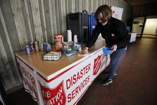 MArch 16, 2014 - 140316  -  Debbie Clarke, emergency disaster services director, The Salvation Army Manitoba and NW Ontario provides refreshments at the Frozen Pipe Citizen Resource Centre at Cindy Klassen Rec Centre Sunday, March 16, 2014. John Woods / Winnipeg Free Press